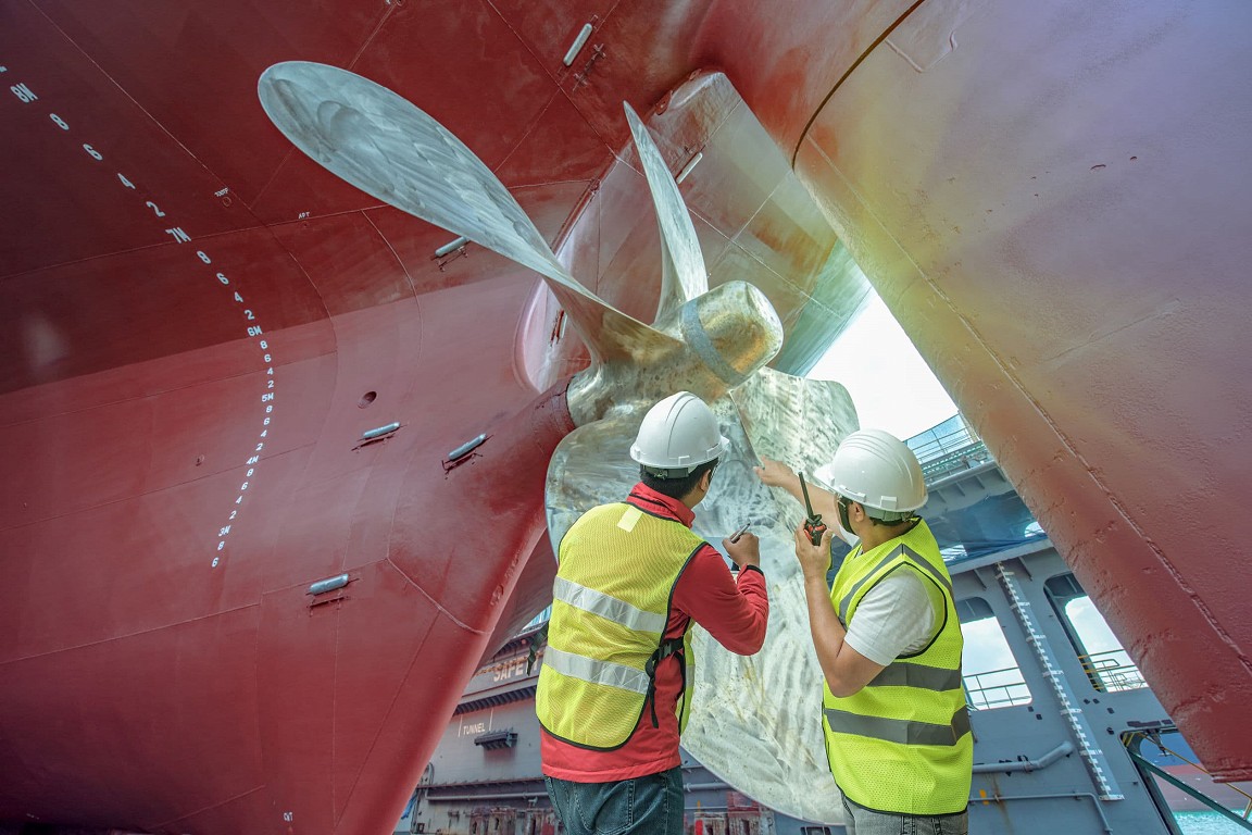 Surveyors inspecting a propellor