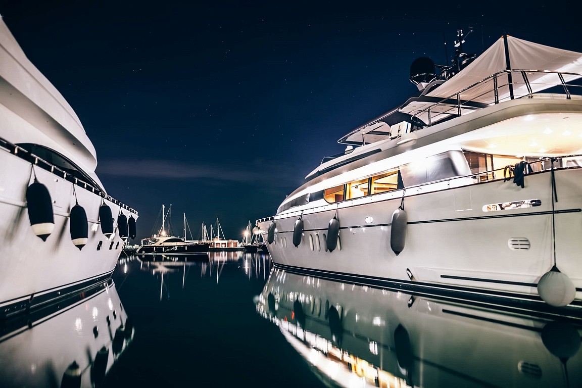 Two luxury yachts in a harbour